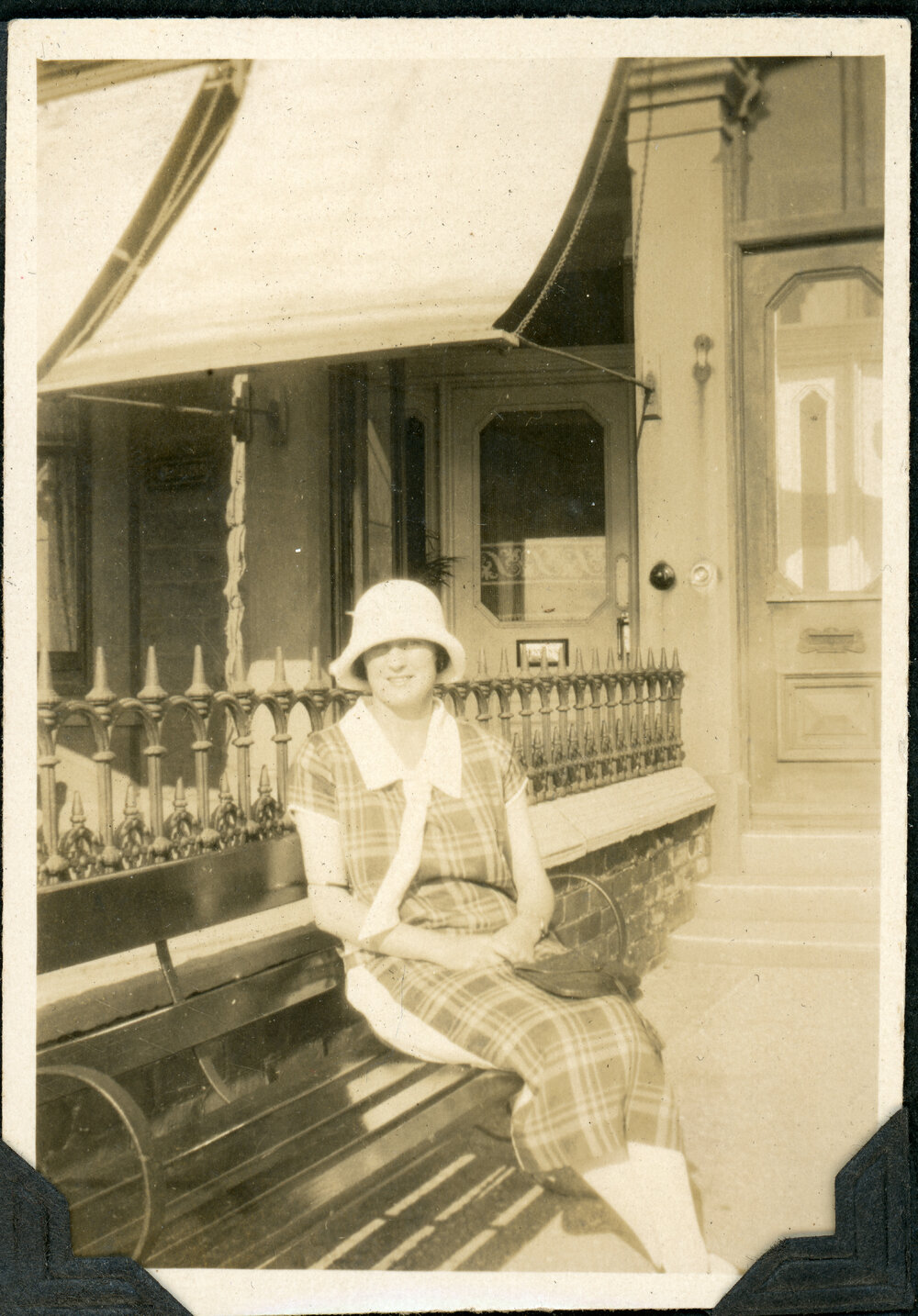 Unknown Woman Sitting On A Bench