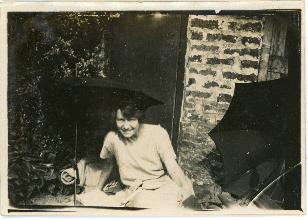 Unknown Woman Relaxing Under Umbrella