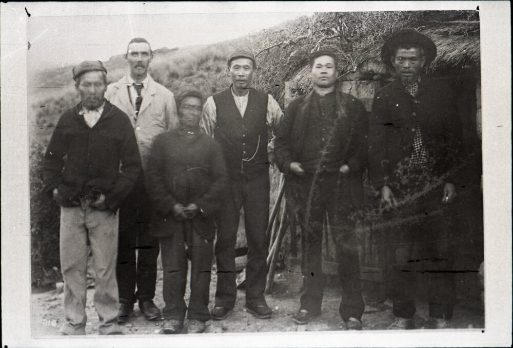 Five Chinese Miners and Rev G. H. McNeur Outside A Cave Dwelling