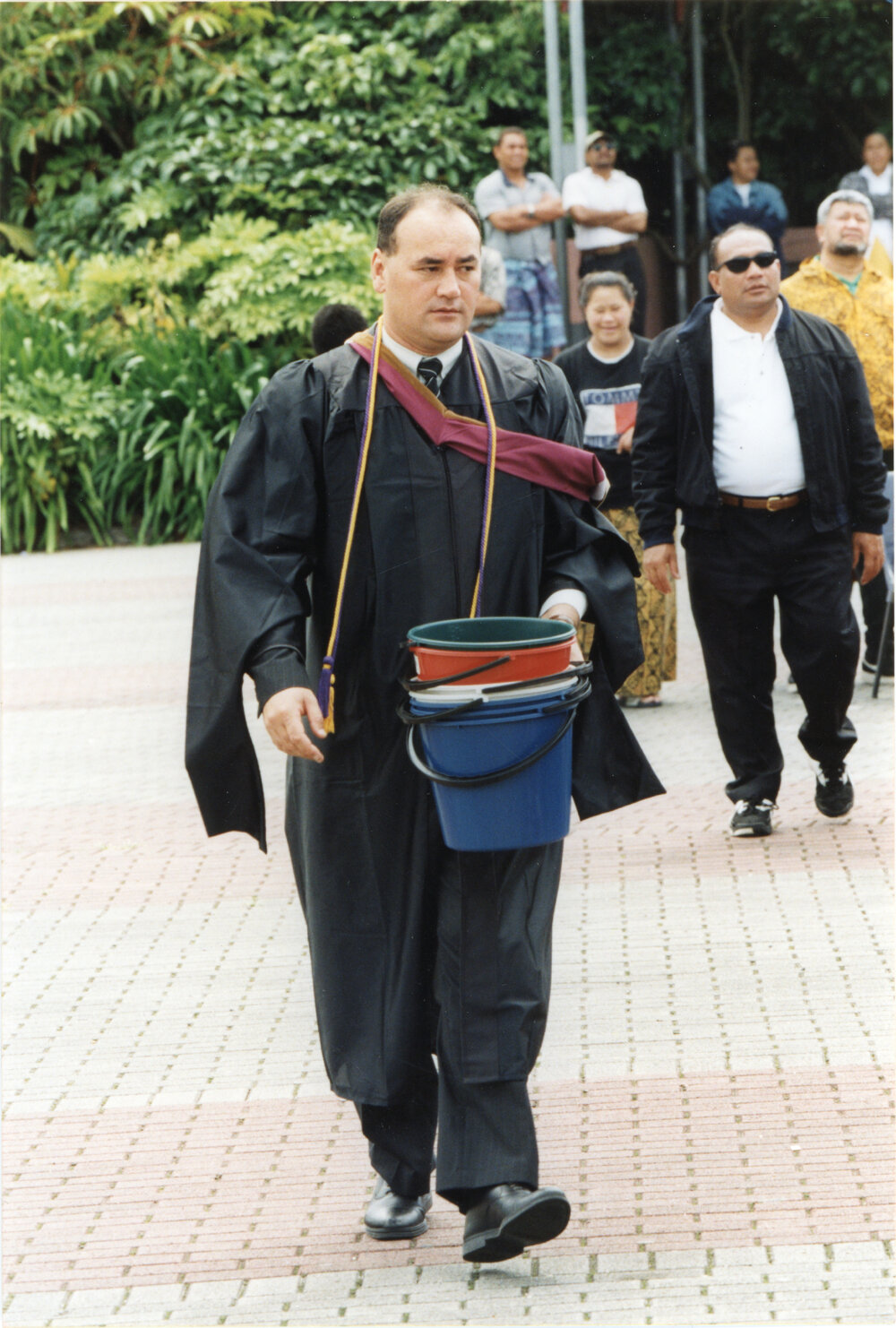Hamish Crooks in Robes Carrying Buckets