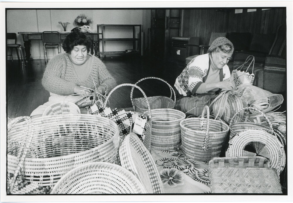 Florida Lukitau and Velina Mohetu weaving baskets