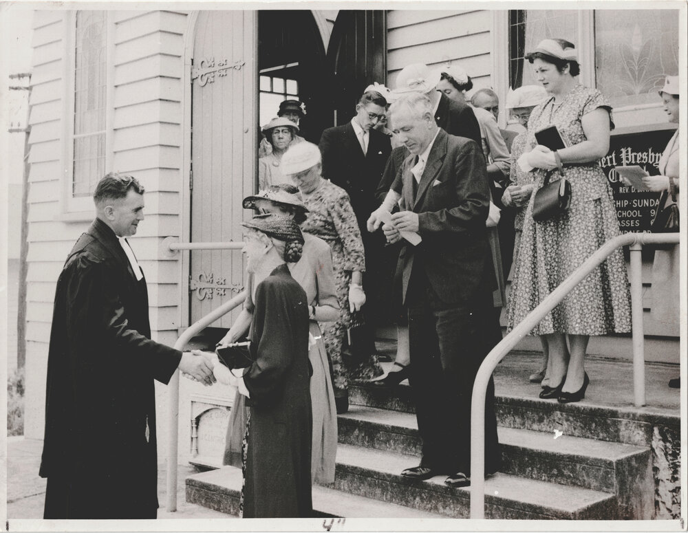 Rev. D. B. Martin greeting parishioners