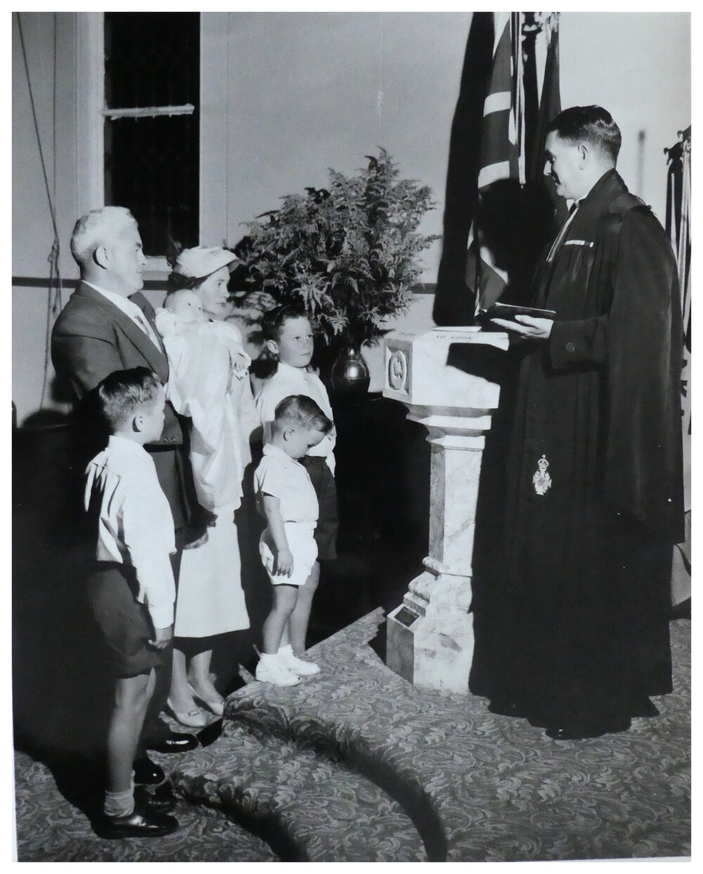 Rev. D. B. Martin performing a baptism
