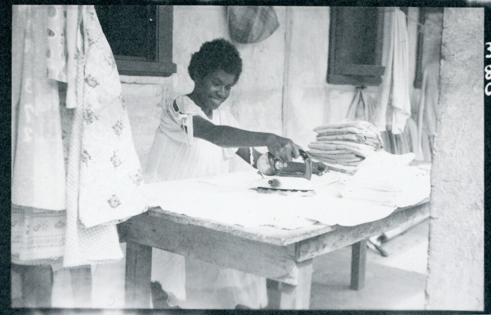 House girl ironing