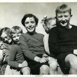 Glendining Home children sitting on a fence, 1955