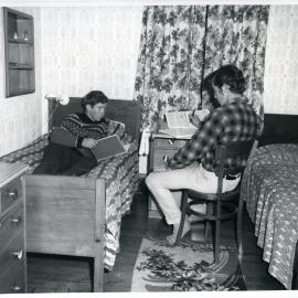 Two unknown boys studying at a Glendining Home Cottage, 1969