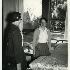 Doreen M. Riddell and unknown student in a Deaconess College bedroom