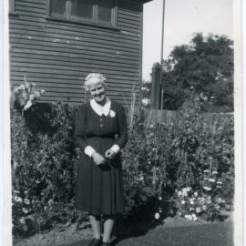 Sister Marion Campbell standing in a garden