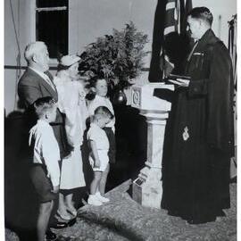 Rev. D. B. Martin performing a baptism