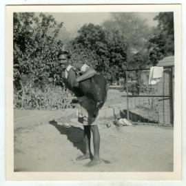 Unidentified man with a skin water bag