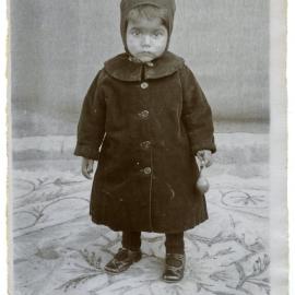 "The baby in his winter clothes"