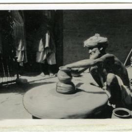 "An Indian potter and his wheel"