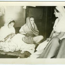 Sister Lorna Aberley chatting to patient's relatives