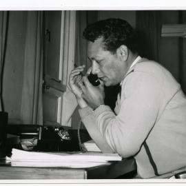Rev Pio Sovala (Bill) Field answering the telephone
