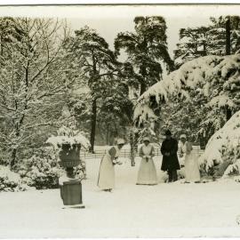 Three nurses and a solider in grounds in snow