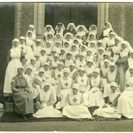 Group of 67 nurses sitting on steps 