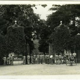 Main gates Oatlands Park, with patients standing at gate