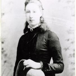 Unidentified woman holding a tennis racquet, portrait 