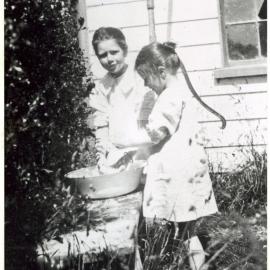 Beth Saunders and Lilla Ellett washing up