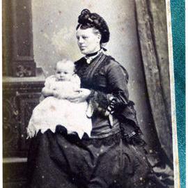 Mary Moore (nee Stewart) holding a baby, portrait