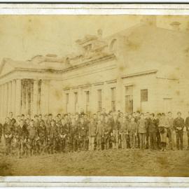 Group of young students, including Alex Smith, standing in front of Otago Boys' High School