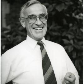 Reverend Doctor Simon H. Rae, laughing