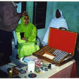 Doctor from the Eye Department examines a patient in the village