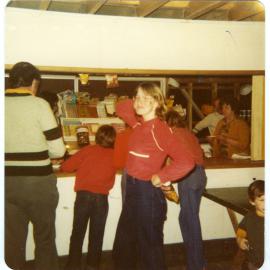 Lynnette Cossill in front of the Tuck Shop