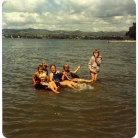Children playing in water at the St. Enoch's Church picnic, 1980