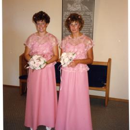 Unidentified woman and Alison Harris as bridesmaids for the wedding of Neil and Roslyn Foster (nee Harris), 1988