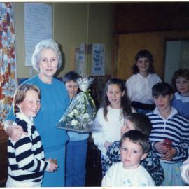 Frances Morton presents Rosemary Harris with a bouquet of flowers