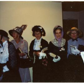 "Entering into the spirit of things," group portrait