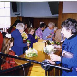Spring congregation at St. Enoch's Church, flower giving, 1996