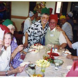 "Friday Lunch, Christmas Feast," Harry Bush gets a hug from Joy Withington, St. Enoch's Church, 1998