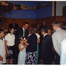 Davey, Elri, Riett, Reverend David and Elna Kriel are welcomed to St. Enoch's Church by Beryl Goodger and others