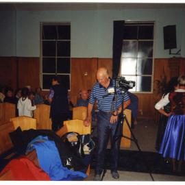Winton Nicholson filming a concert, St. Enoch's Church