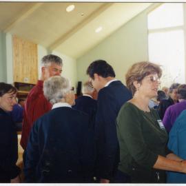 Muir family speaking with Reverend David Kriel, St. Enoch's Church