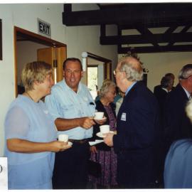 Glenys Hughes and husband speak with Denis Gordon, Beth Elliott in background, St. Enoch's Church