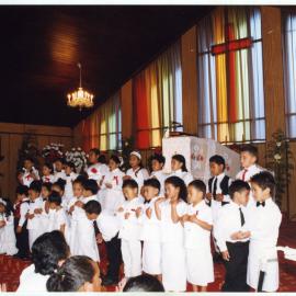 Children perform at Glen Eden Pacific Islanders Church during a White Sunday service, 2002 