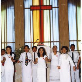 Group of children perform at Glen Eden Pacific Islanders Church during a White Sunday service, 2002