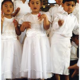 Five young children perform at Glen Eden Pacific Islanders Church during White Sunday service, 2002