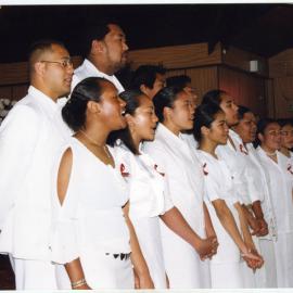 Young women and men sing at the White Sunday service at Glen Eden Pacific Islanders Church, 2002