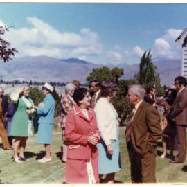 Unidentified adults talk after a service at Cromwell Church