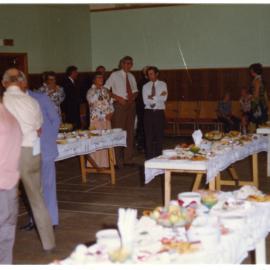 Parishioners of Cromwell Church enjoy refreshments in a school gymnasium 