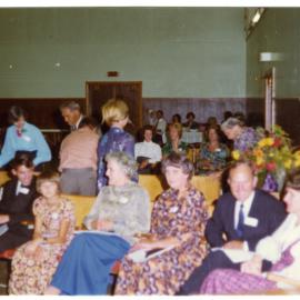 Seated parishioners fill a sports gymnasium, Cromwell Church