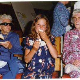 Two women and a young girl eating desserts, Cromwell Church