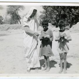An unidentified woman and two children
