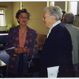 Muriel Aldridge and V. Sinclair photographed talking, St. Columba