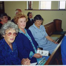 Charlotte Scott, Pat Glass and Helen Cruickshanks, seated in a pew, St. Columba, Christchurch 