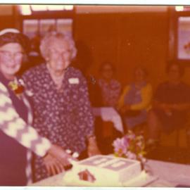 Mrs. Graham and Mrs. Crum cutting the 50th anniversary cake of St. Columba Women's Group, Christchurch
